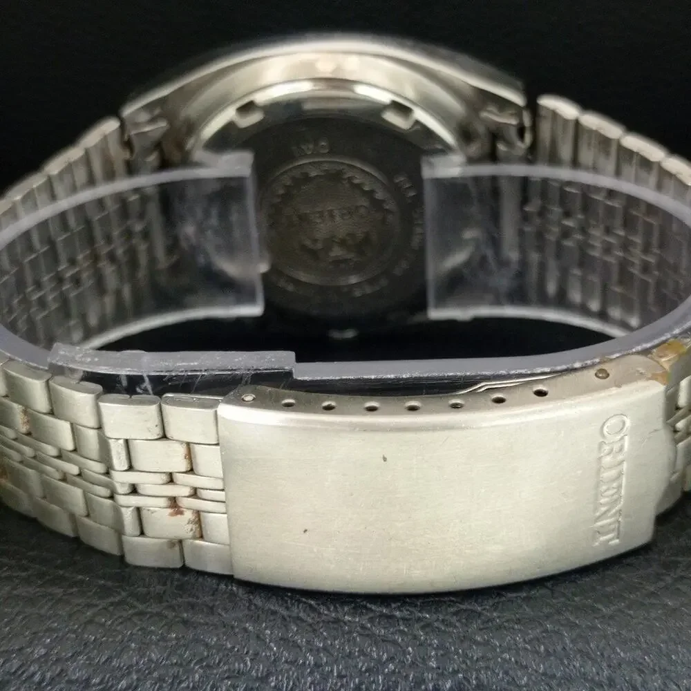 Vintage 1973 Orient Manual Mens Silver Watch W/daydate & Gold accents